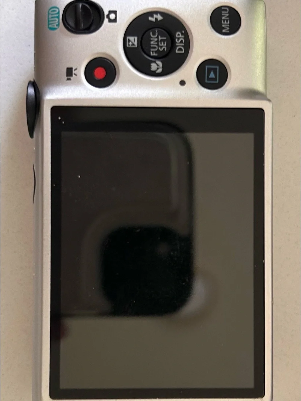 Canon compact camera image in silver and black tones - Picture 2 of 4